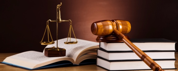 Photo of law books, gavel and balance