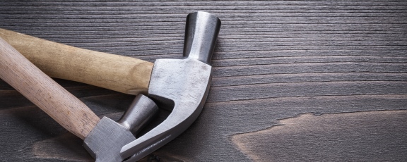 image of hammers on a piece of wood