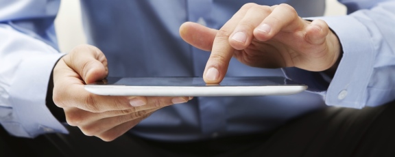 man using digital tablet